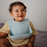 Mushie Silicone Bib - White Daisy - Image 4